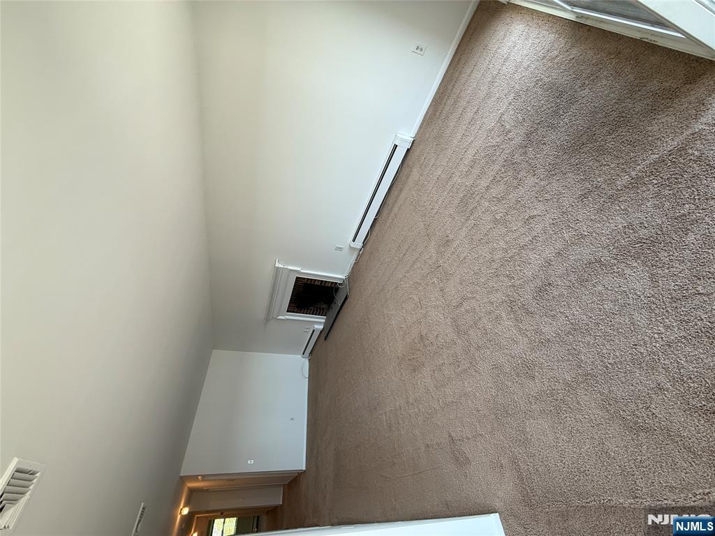 1276 River Road, Unit 2 Edgewater, NJ 07020 - Photo 3 of 16 a view of an empty room and kitchen