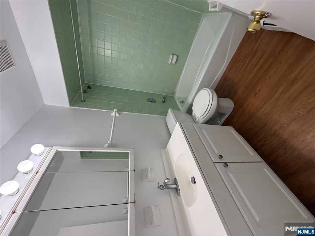 1276 River Road, Unit 2 Edgewater, NJ 07020 - Photo 10 of 16 a bathroom with a sink and a mirror