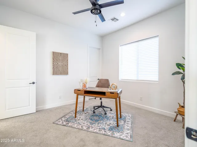 a work room with furniture and a window