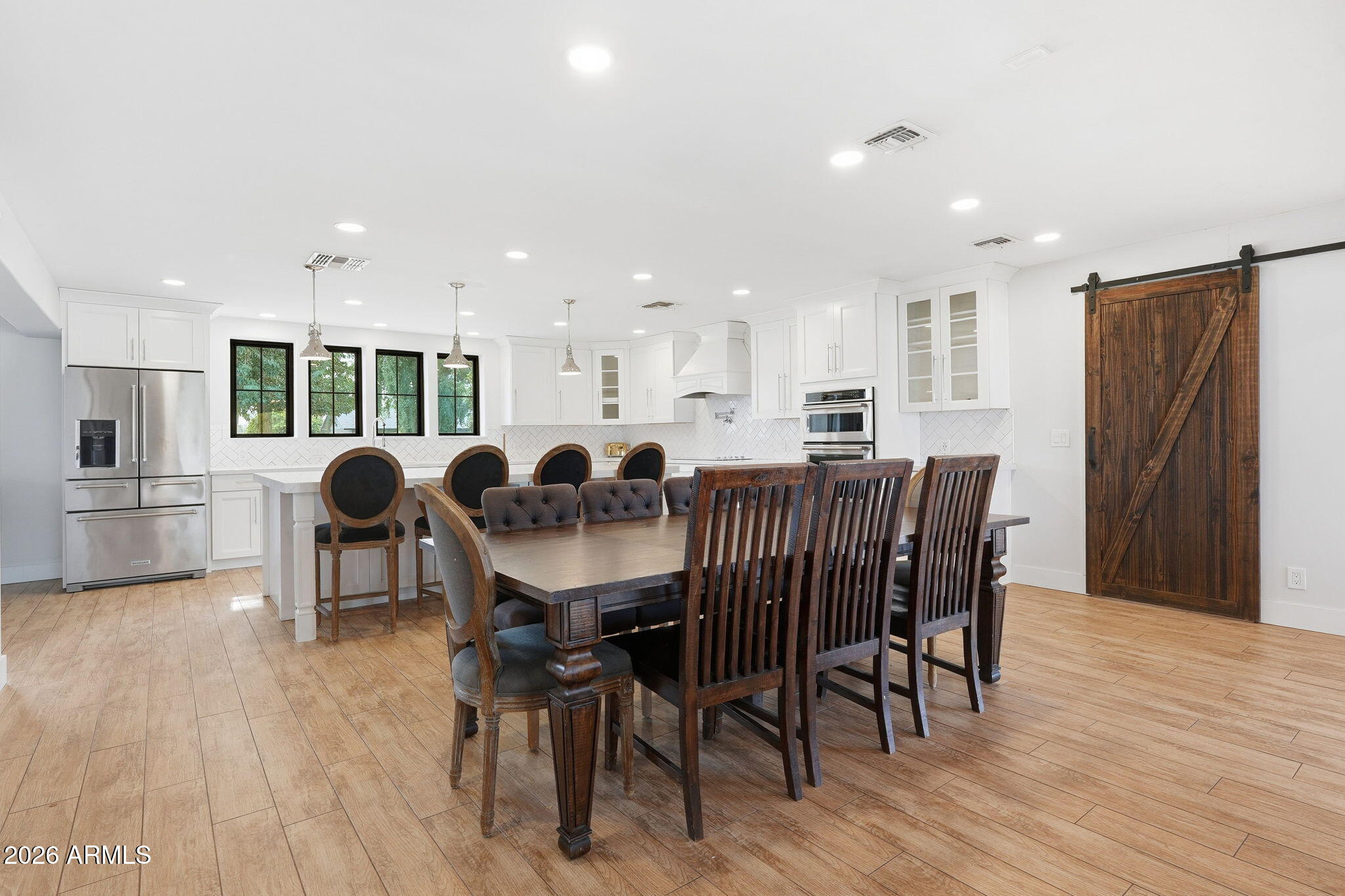 2858 East Redfield Road Gilbert, AZ 85234 - Photo 30 of 60 a view of a dining room with furniture and wooden floor