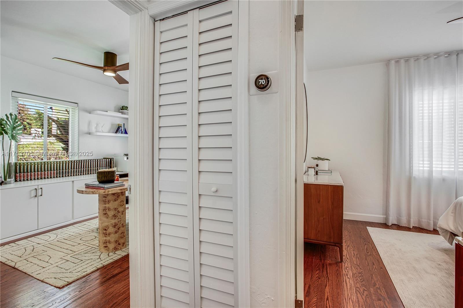 1926 Southwest 17th Terrace Miami, FL 33145 - Photo 15 of 38 walk in closet with wooden floor and bathroom view