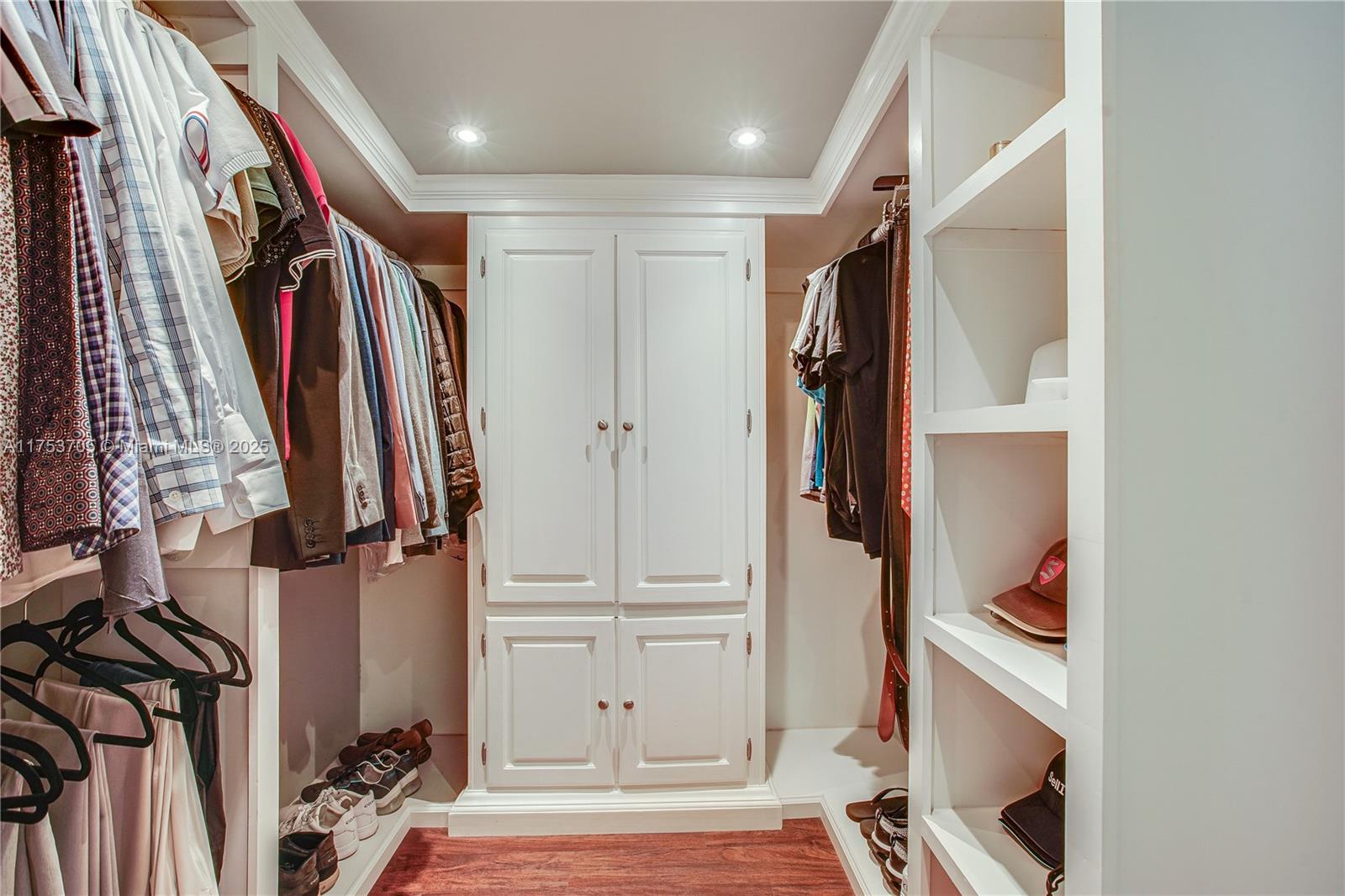 1926 Southwest 17th Terrace Miami, FL 33145 - Photo 18 of 38 a view of walk in closet with clothes and shoes
