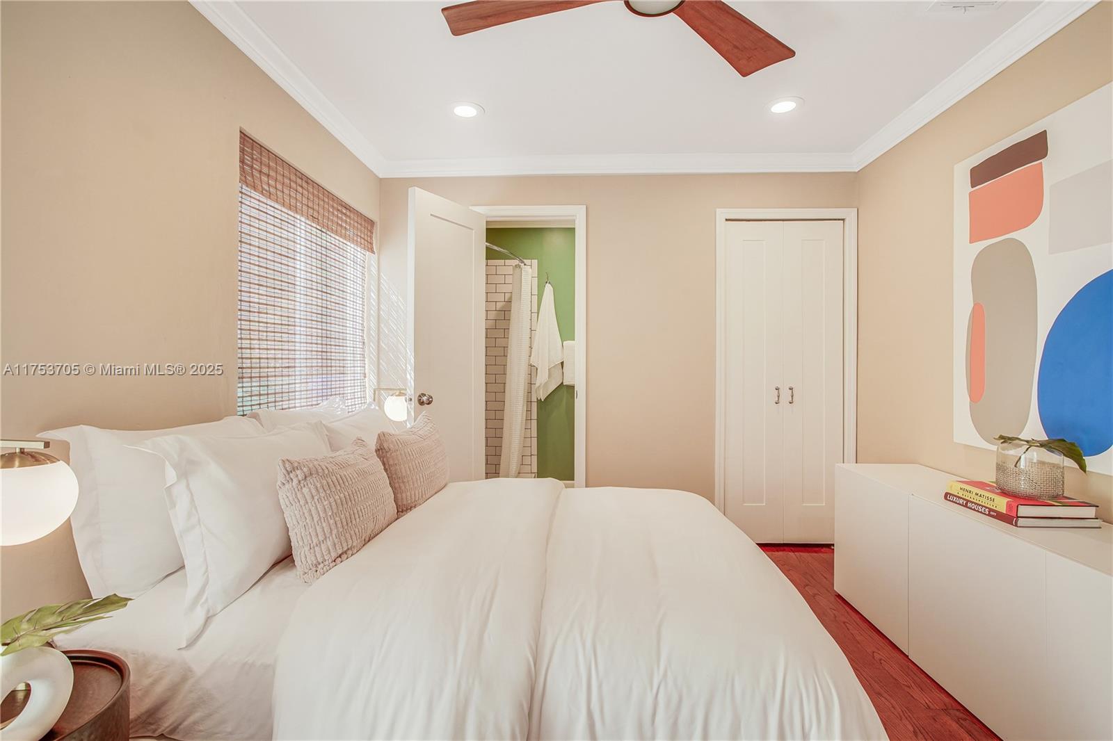 1926 Southwest 17th Terrace Miami, FL 33145 - Photo 22 of 38 a bedroom with a bed and a mirror