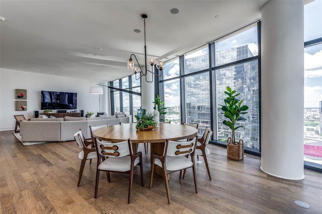 1918 Olive Street, Unit 2002 Dallas, TX 75201 - Photo 12 of 29 a view of a dining room with furniture window and wooden floor