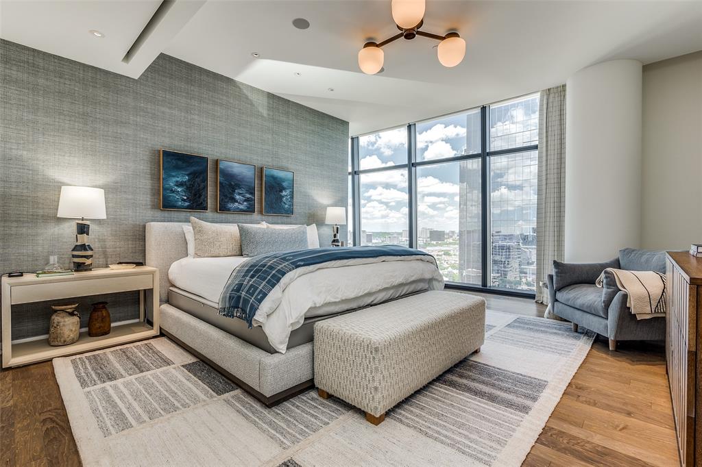 1918 Olive Street, Unit 2002 Dallas, TX 75201 - Photo 13 of 29 a spacious bedroom with a large bed and a couch