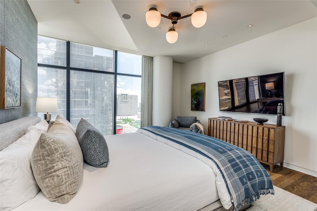 1918 Olive Street, Unit 2002 Dallas, TX 75201 - Photo 14 of 29 a bedroom with bed and a large window