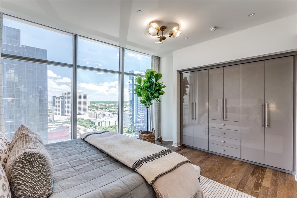 1918 Olive Street, Unit 2002 Dallas, TX 75201 - Photo 19 of 29 a bedroom with a large bed and a large window
