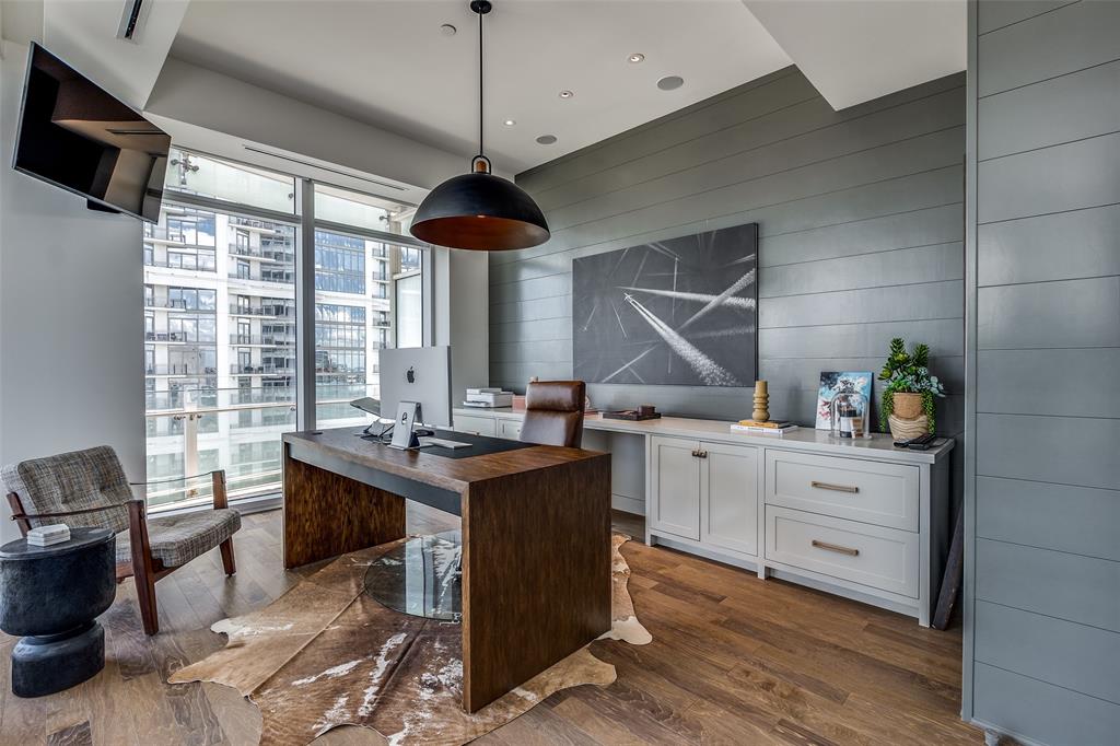 1918 Olive Street, Unit 2002 Dallas, TX 75201 - Photo 21 of 29 a kitchen with stainless steel appliances granite countertop a stove and a wooden floors