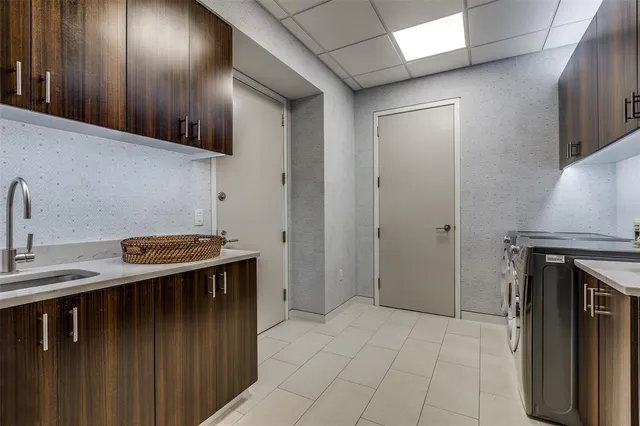 a kitchen that has a sink and a stove