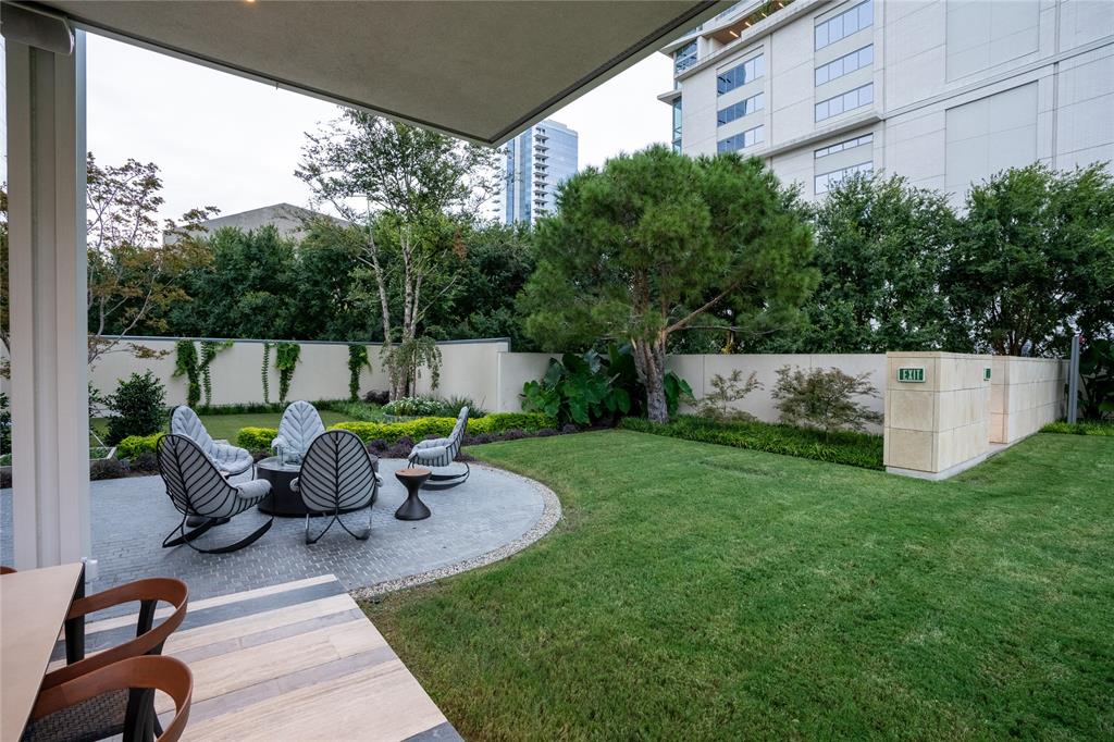 1918 Olive Street, Unit 2002 Dallas, TX 75201 - Photo 26 of 29 a view of a patio with table and chairs potted plants with wooden floor