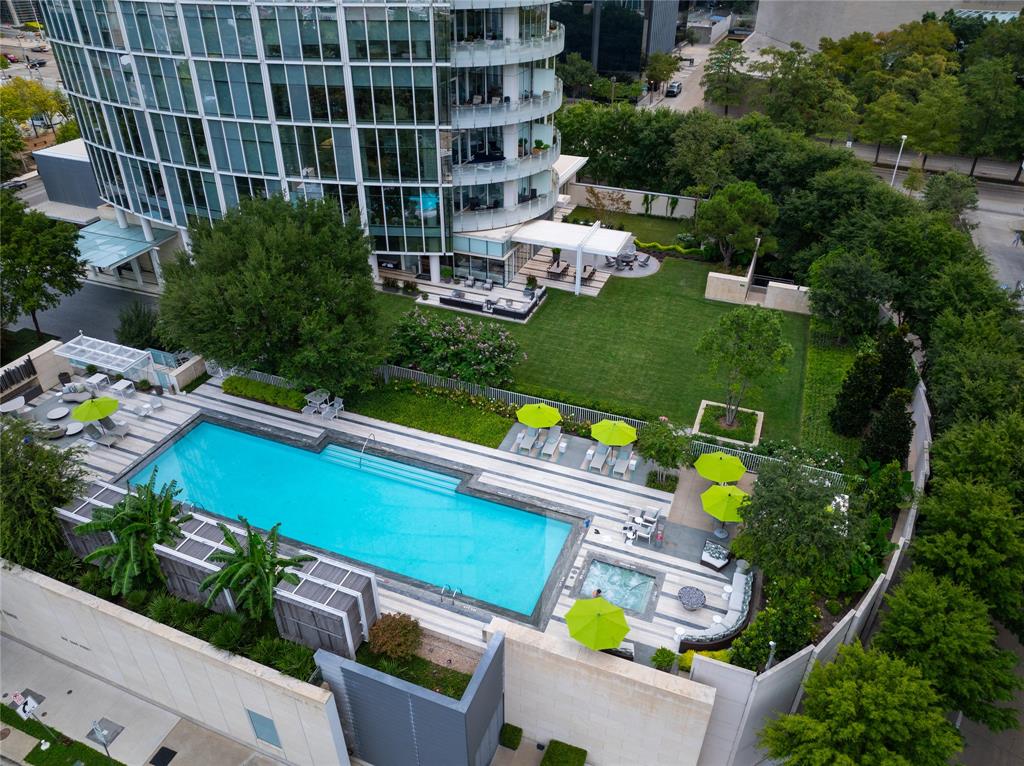 1918 Olive Street, Unit 2002 Dallas, TX 75201 - Photo 29 of 29 a view of a chairs and table in a backyard