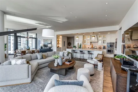 a living room with lots of furniture and a flat screen tv