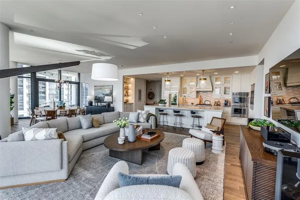 a living room with lots of furniture and a flat screen tv