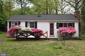 a front view of house with yard