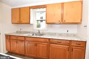 a bathroom with a sink and a window