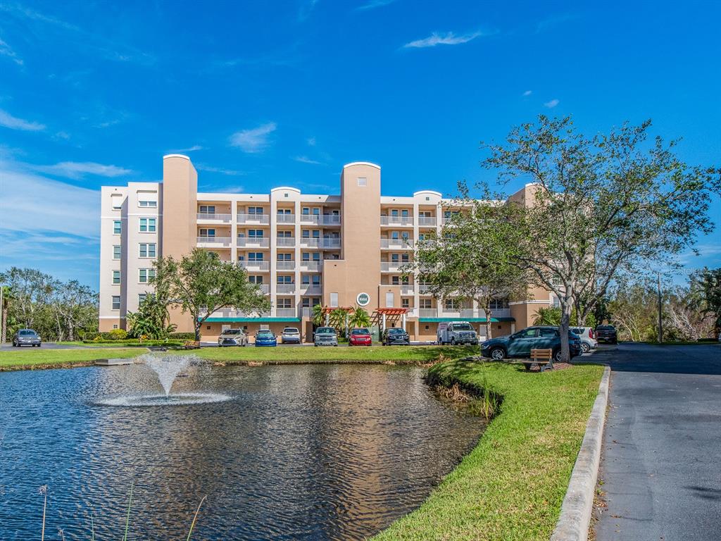 6550 Shoreline Drive, Unit 7502 St. Petersburg, FL 33708 - Photo 2 of 30 a view of a city with tall buildings and a big yard