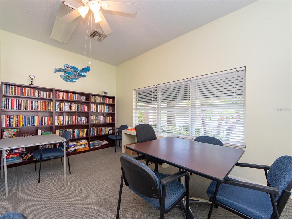6550 Shoreline Drive, Unit 7502 St. Petersburg, FL 33708 - Photo 27 of 30 a view of a dining room with furniture and a window