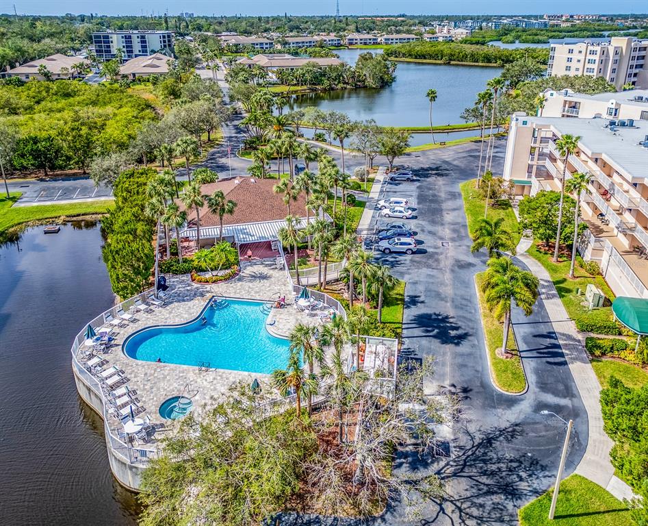 6550 Shoreline Drive, Unit 7502 St. Petersburg, FL 33708 - Photo 29 of 30 an aerial view of a house with a swimming pool yard and lake view