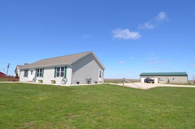 a view of a house with a big yard