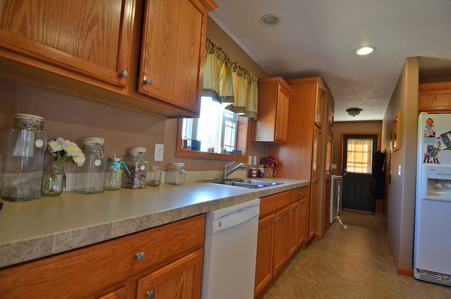 3503 East 10th Road Utica, IL 61373 - Photo 3 of 14 a kitchen with sink a refrigerator and cabinets