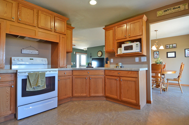 3503 East 10th Road Utica, IL 61373 - Photo 5 of 14 a kitchen with stainless steel appliances granite countertop a stove and cabinets