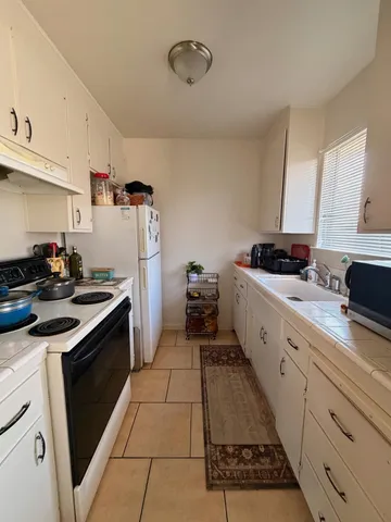 a kitchen with a stove and a sink