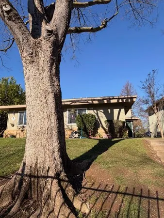 front view of a house with yard porch and sitting area