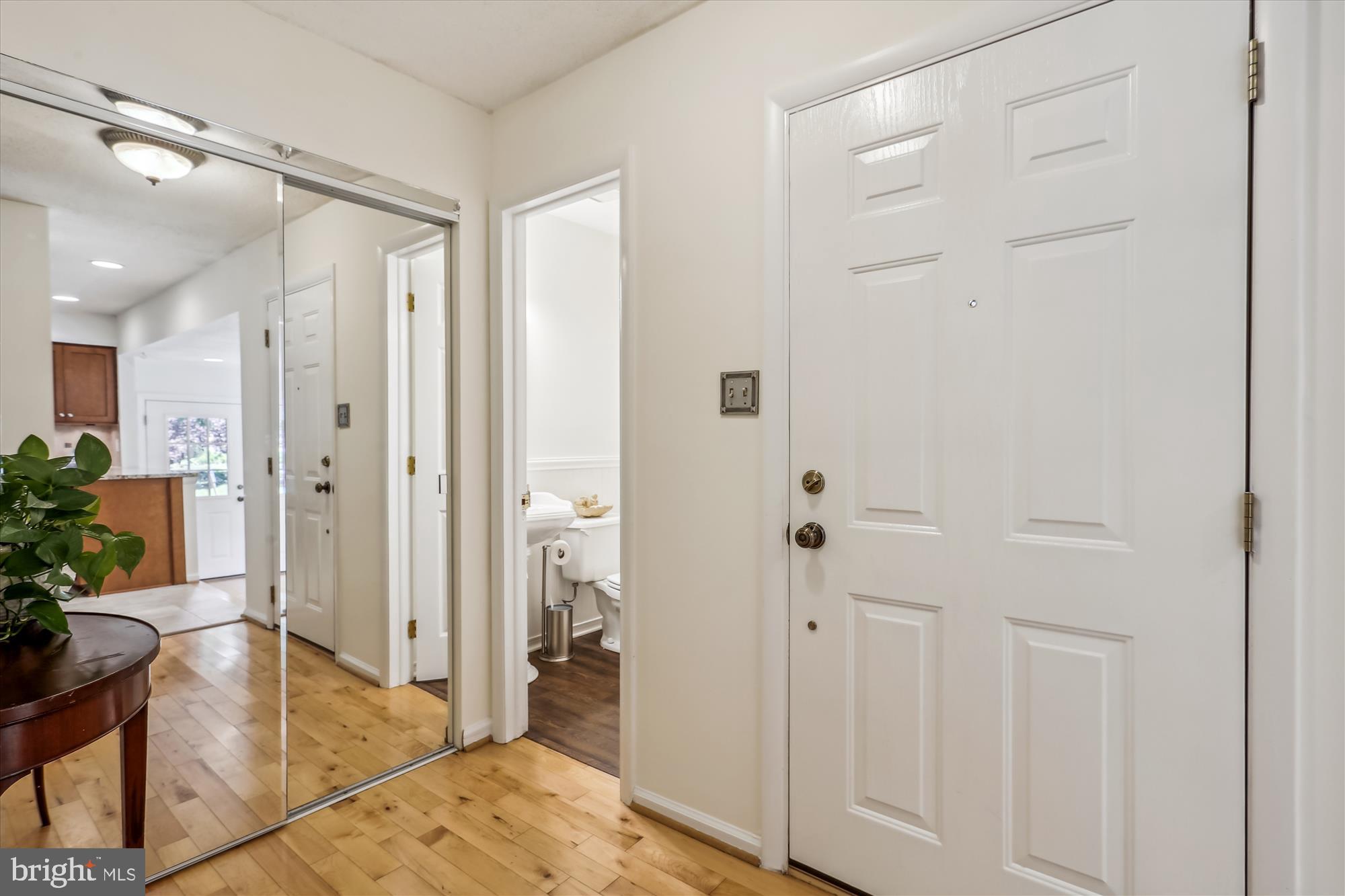 2301 Glade Bank Way Reston, VA 20191 - Photo 5 of 49 a spacious bathroom with a glass shower door and mirror