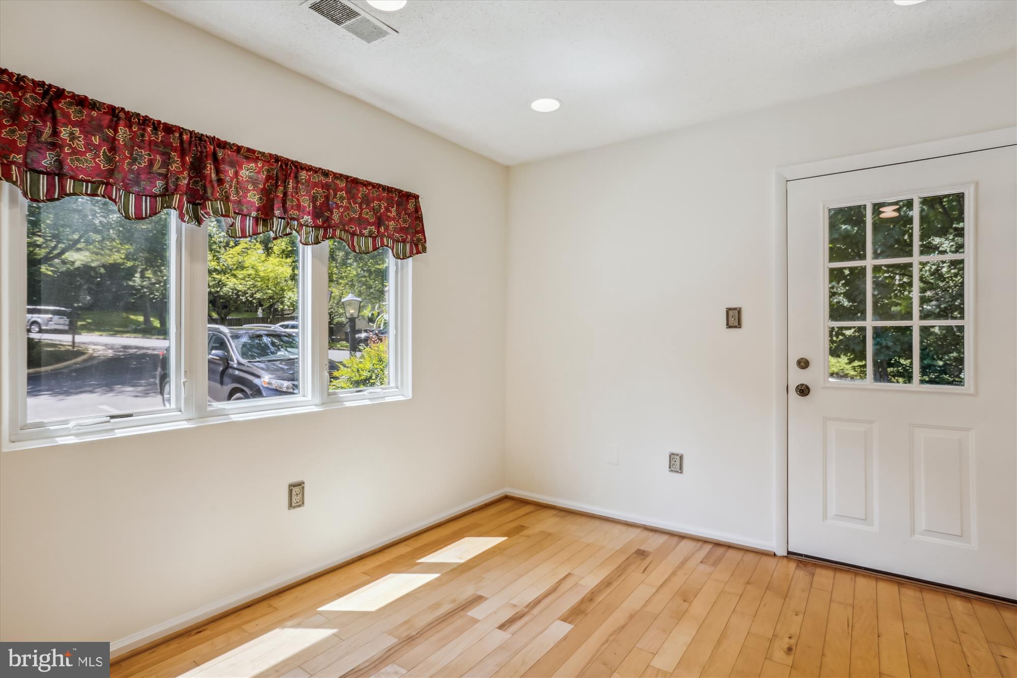 2301 Glade Bank Way Reston, VA 20191 - Photo 8 of 49 a view of empty room with wooden floor and fan