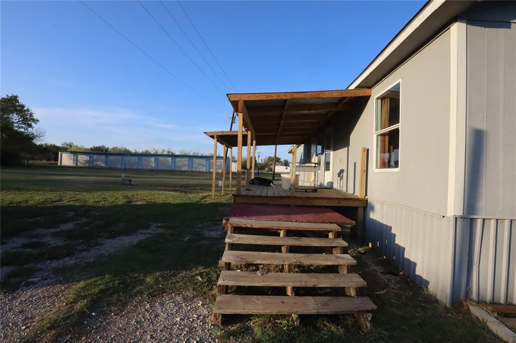 1437 West Loop 254 Ranger, TX 76470 - Photo 19 of 27 a front view of a house with a yard