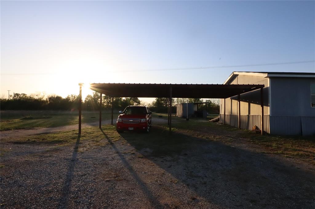 1437 West Loop 254 Ranger, TX 76470 - Photo 27 of 27 a view of a couches in the patio next to a yard