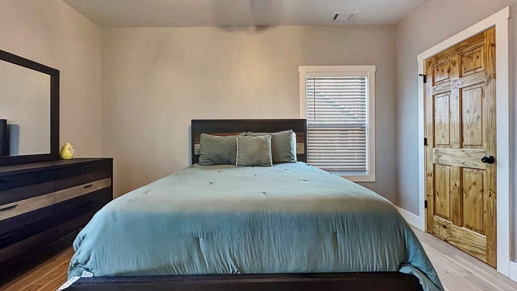 374 Prince Drive Morganton, GA 30560 - Photo 25 of 60 a bedroom with a bed and a window