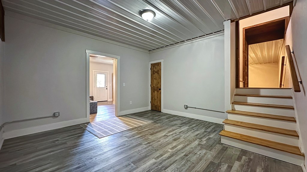 374 Prince Drive Morganton, GA 30560 - Photo 34 of 60 a view of an empty room with wooden floor and a window