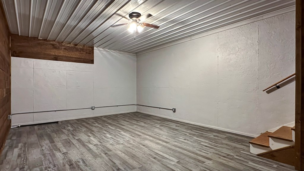 374 Prince Drive Morganton, GA 30560 - Photo 46 of 60 a view of empty room with wooden floor and fan
