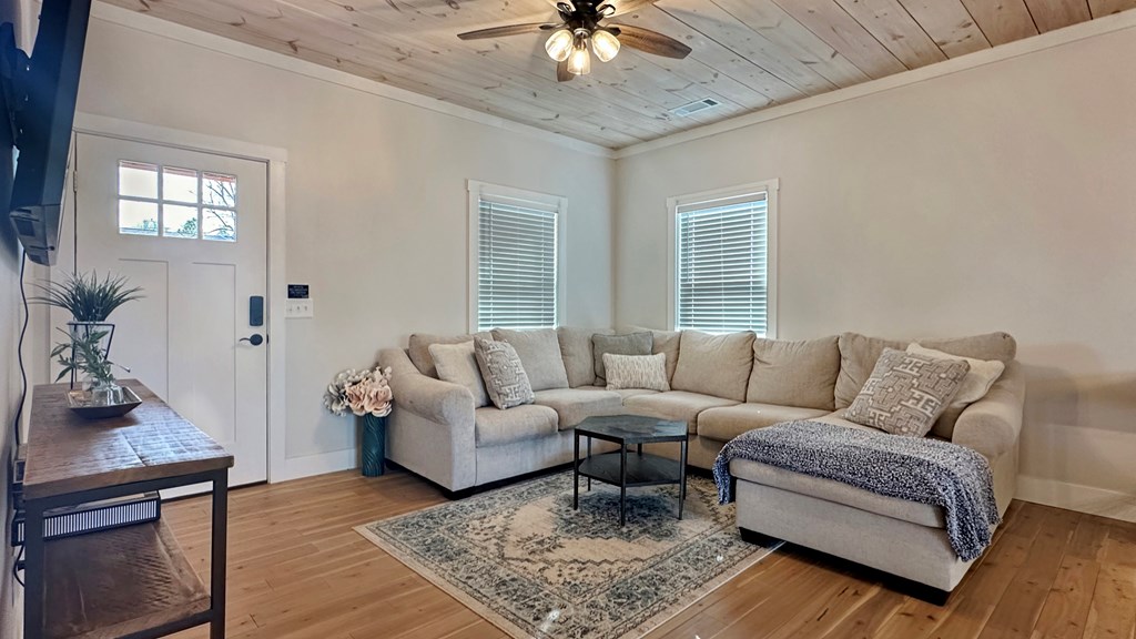 374 Prince Drive Morganton, GA 30560 - Photo 6 of 60 a living room with furniture and a chandelier