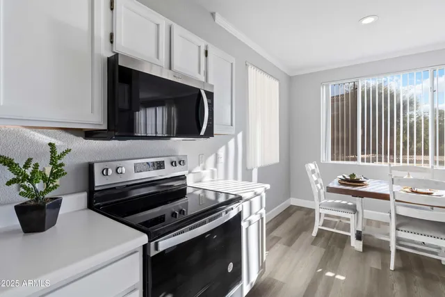 a kitchen with a stove and a microwave