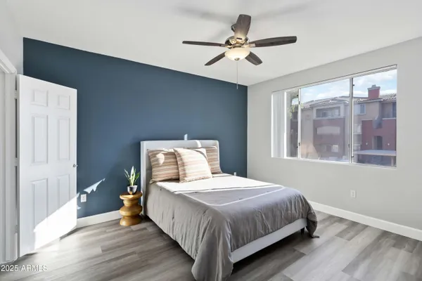 a bedroom with a bed and window