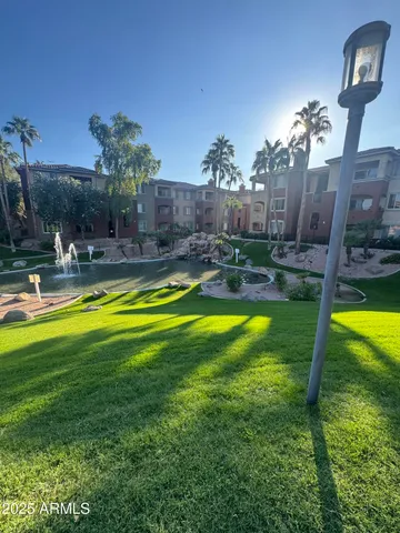 a view of a swimming pool with a patio