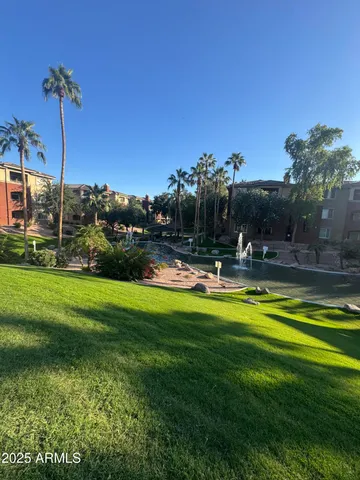 a view of swimming pool is middle in the garden