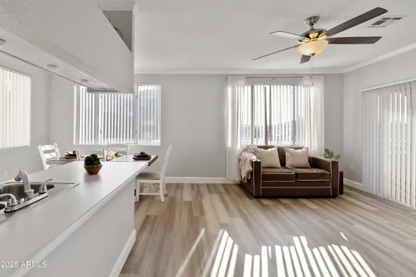 a living room with furniture and a large window