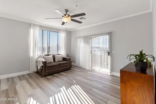 a living room with furniture and a large window