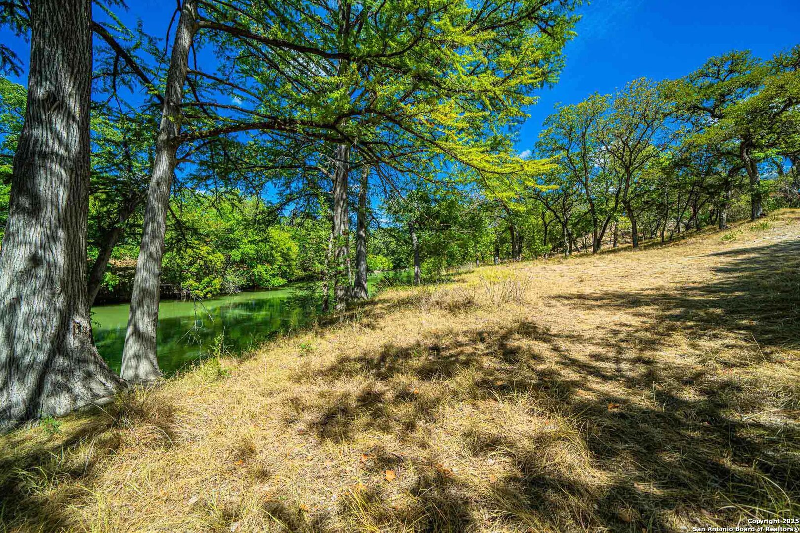 105 A Oleander Road Comfort, TX 78013 - Photo 14 of 25 a view of a lake with a yard