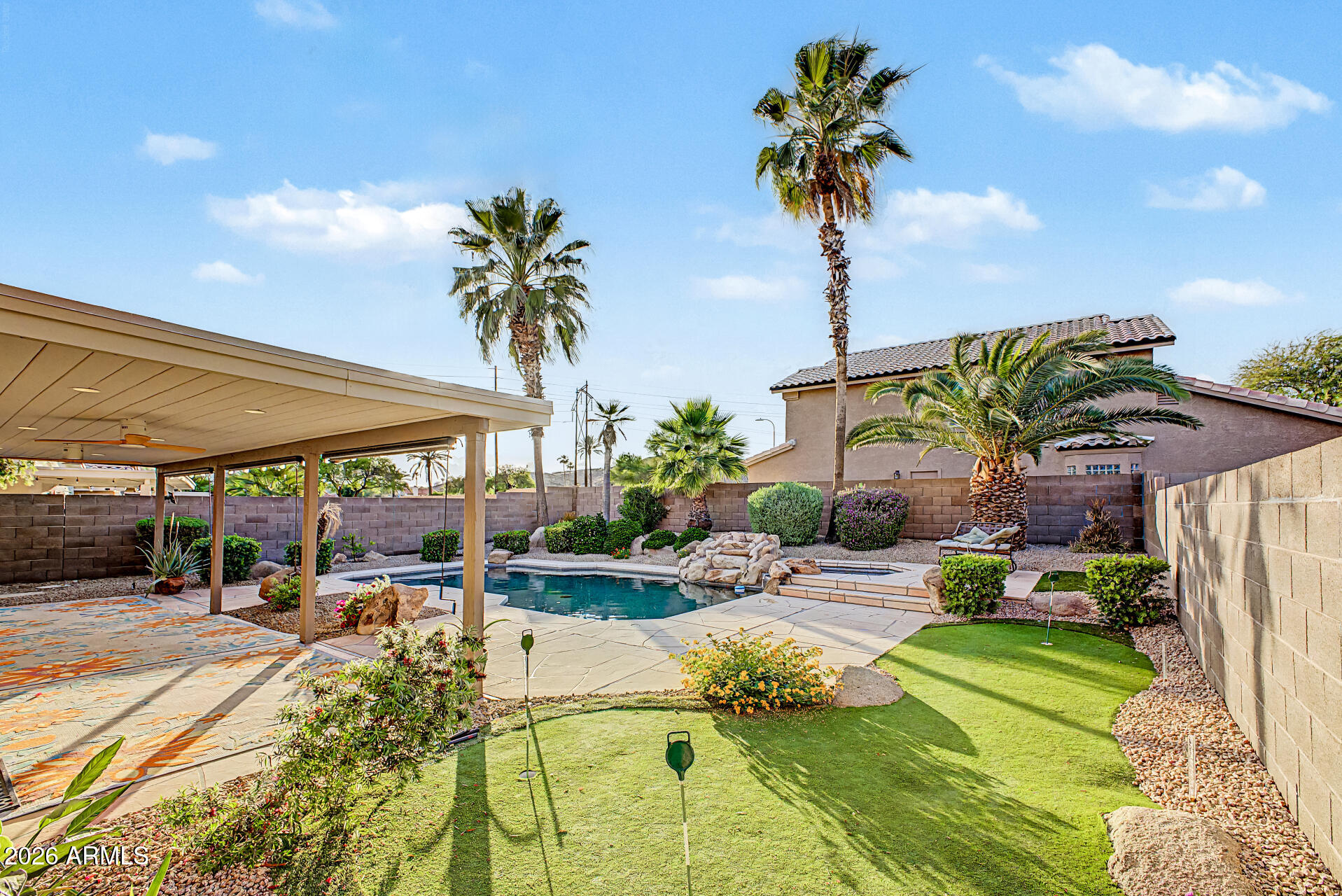 4102 East Rock Wren Road Phoenix, AZ 85044 - Photo 25 of 25 a view of a swimming pool with a patio