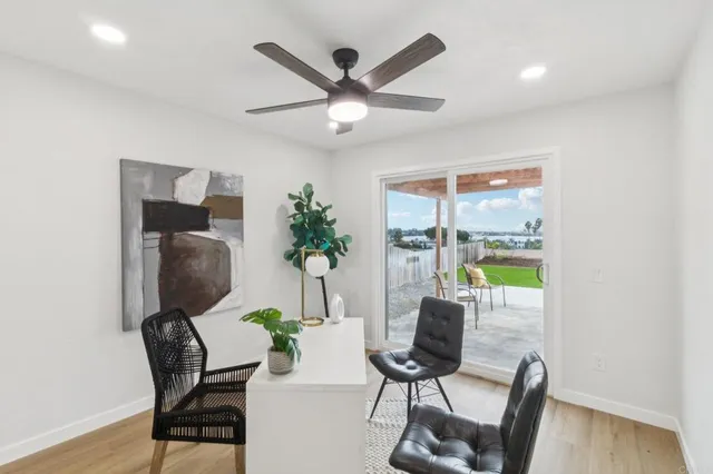 a living room with furniture a potted plant and a potted plant