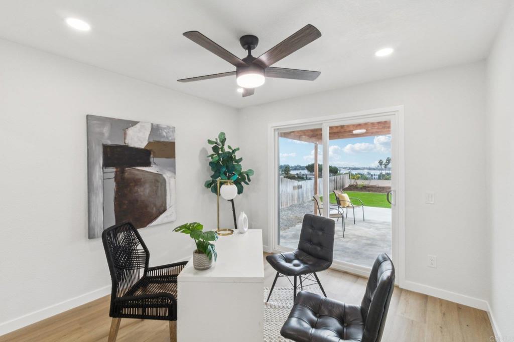 4723 Rim Rock Road Oceanside, CA 92056 - Photo 16 of 29 a workspace with furniture and a potted plant