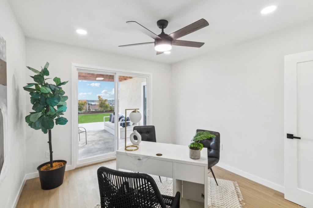 4723 Rim Rock Road Oceanside, CA 92056 - Photo 17 of 29 a living room with furniture a potted plant and a potted plant