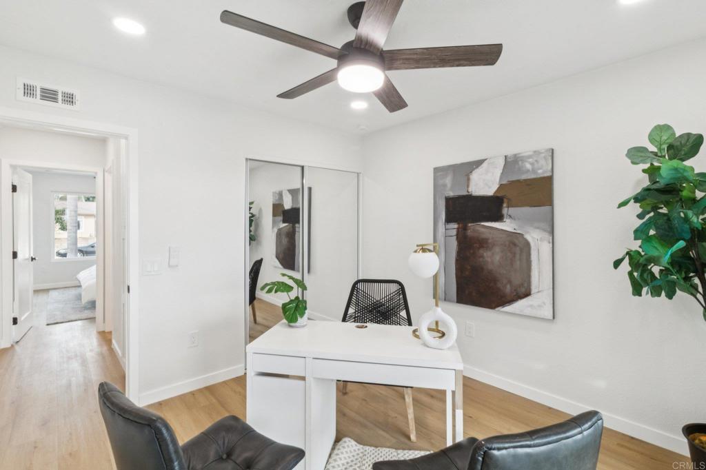 4723 Rim Rock Road Oceanside, CA 92056 - Photo 18 of 29 a living room with furniture and a potted plant