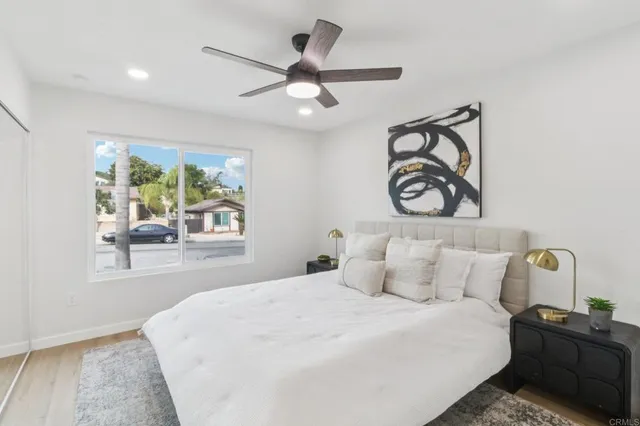 a bedroom with a bed window and a walk in closet
