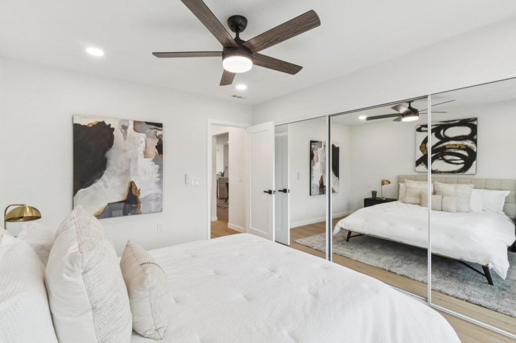 4723 Rim Rock Road Oceanside, CA 92056 - Photo 22 of 29 a bedroom with a bed and a walk in closet