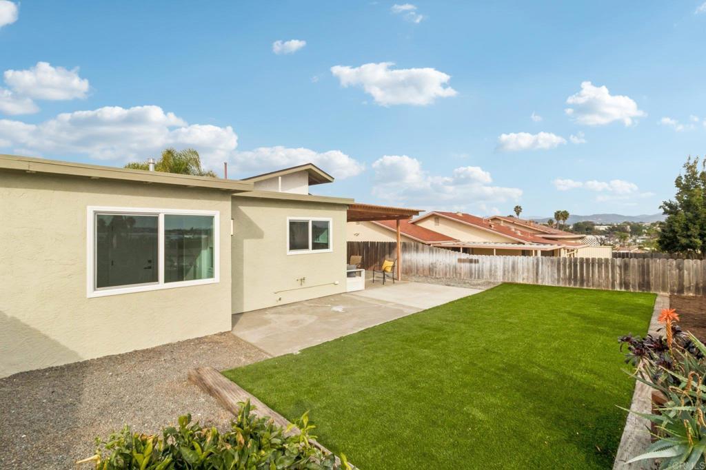 4723 Rim Rock Road Oceanside, CA 92056 - Photo 28 of 29 a view of house with backyard outdoor seating and barbeque oven